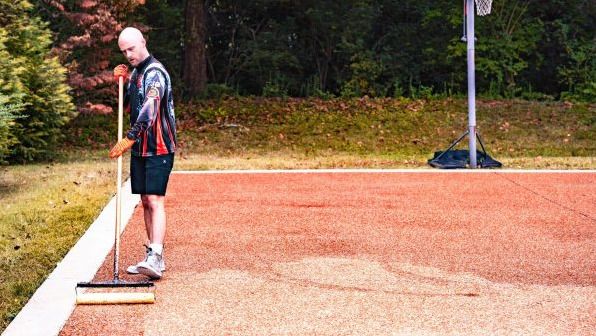 man doing paver sealing_