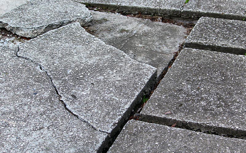 cracked and sunken pavers before professional paver repair in Florida cracked and sunken pavers before professional paver repair in Florida